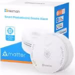 Heiman S1-TM Matter-Rauchmelder mit Temperatur- und Luftfeuchtigkeitssensor neben der Verpackung